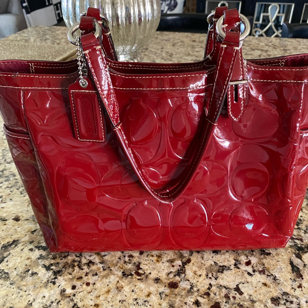 Authentic red, patent leather Coach purse.